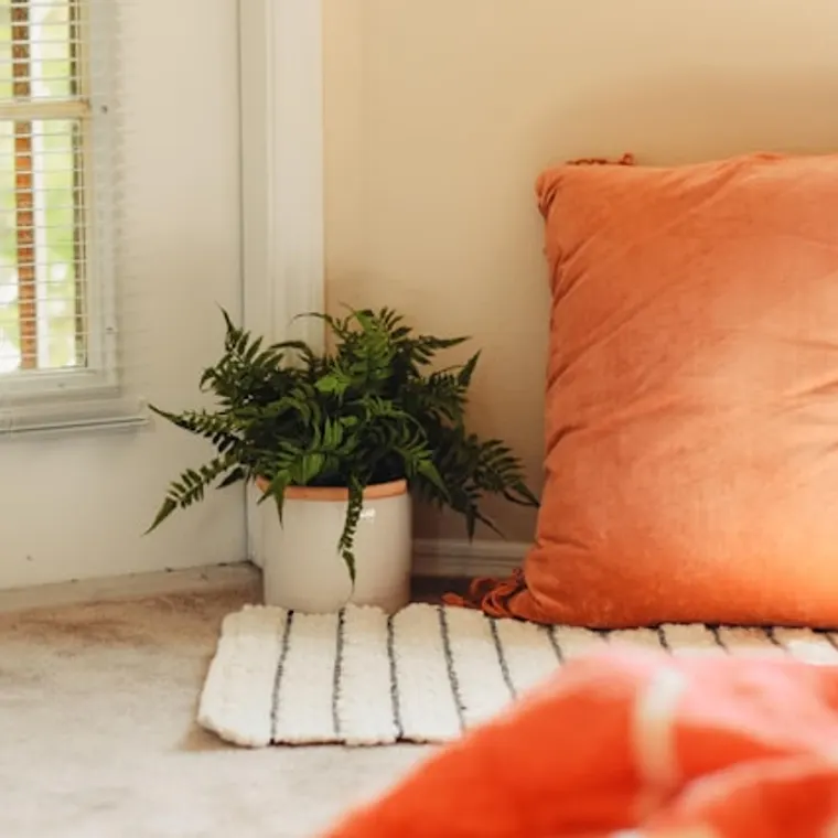 Reading chair in a cosy corner with a lamp