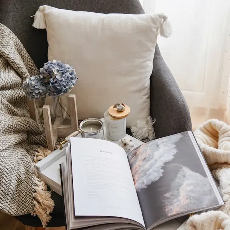 Reading nook styled with cushions by a window