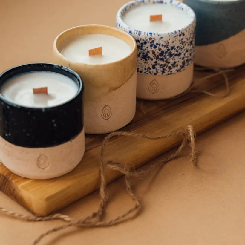 Three soy candles in oatmeal vessels