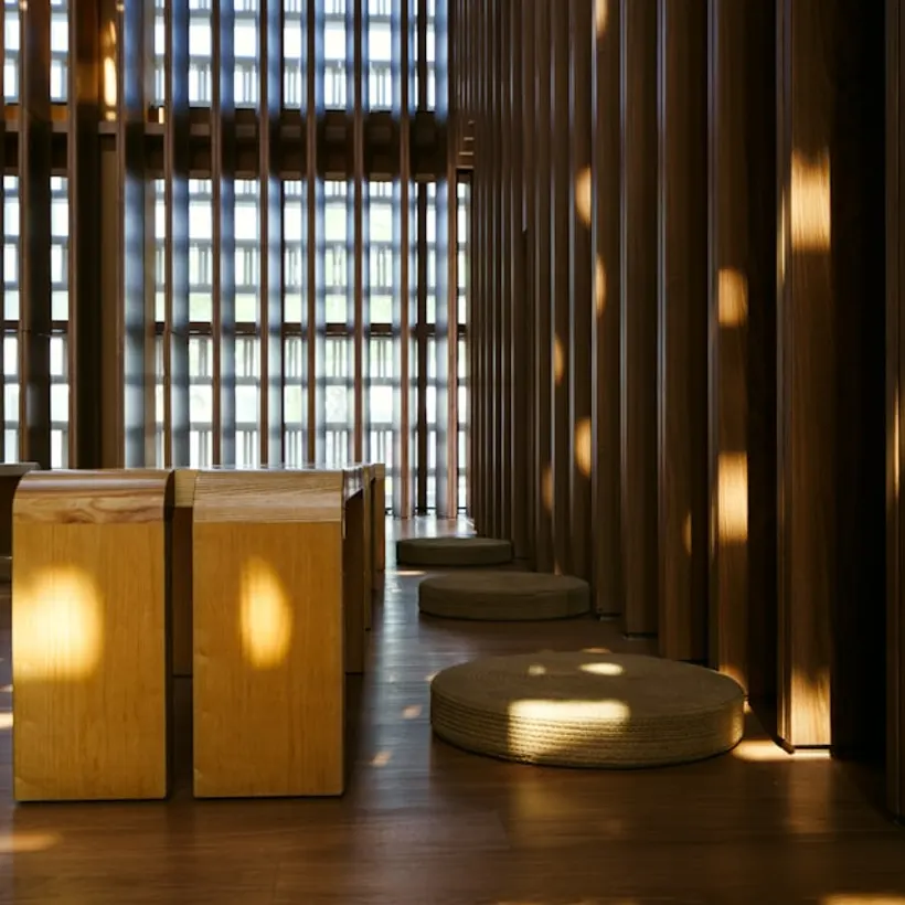 Solid oak seiza meditation bench in a sunlit room