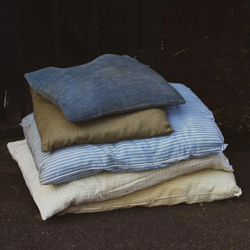 Stonewashed linen throw blankets folded in a stack